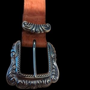 Small brown leather belt with silver embellishments